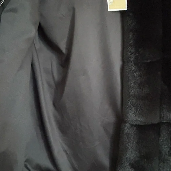 Beautiful NEW black faux fur Michael Kors Vest.Sized XXS, fits like a small.